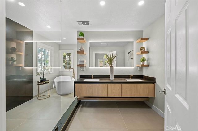 a bathroom with a toilet sink and shower