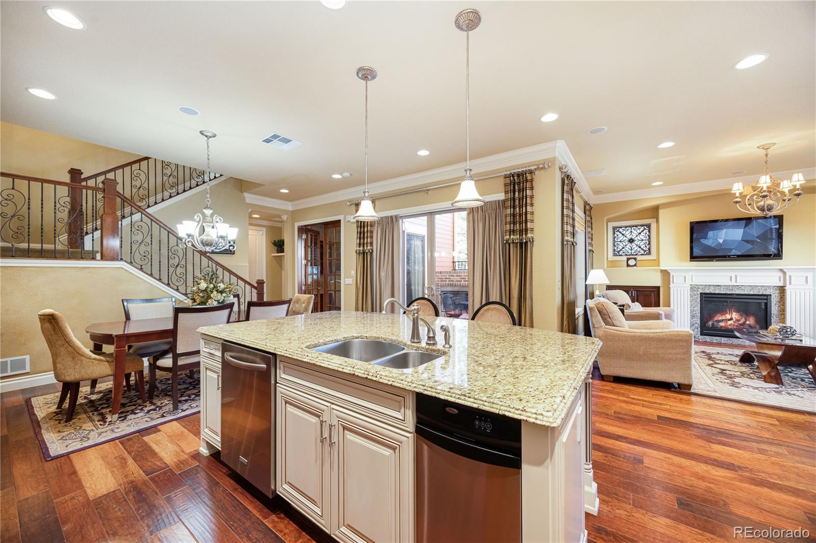 9132 Mornington Way Lone Tree, CO 80124 - Photo 11 of 44 a large kitchen with a table and chairs
