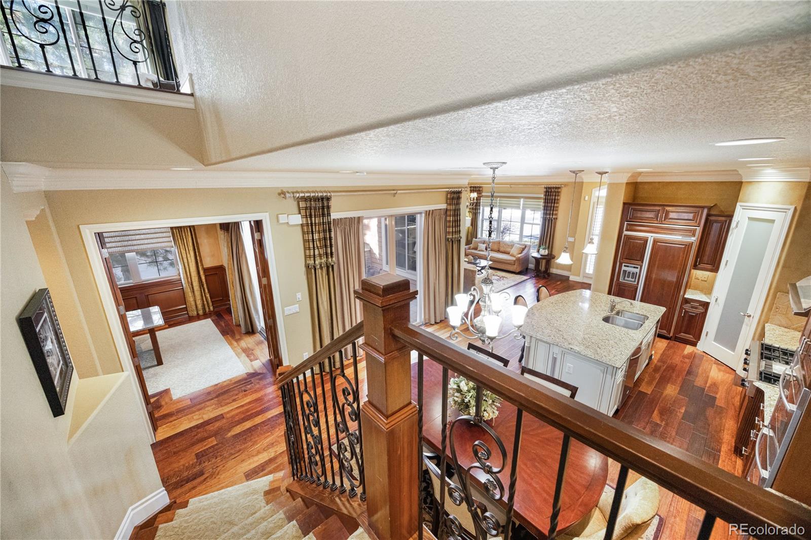 9132 Mornington Way Lone Tree, CO 80124 - Photo 17 of 44 a view of a livingroom with furniture wooden floor and windows