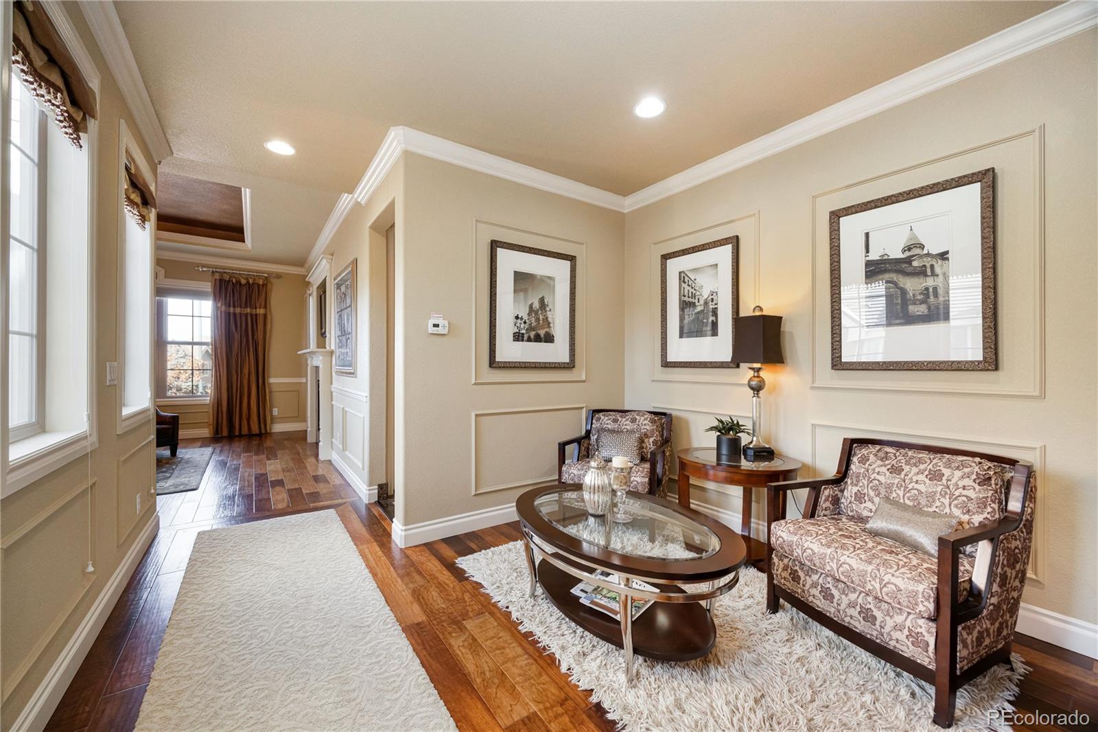9132 Mornington Way Lone Tree, CO 80124 - Photo 19 of 44 a living room with furniture and a large window