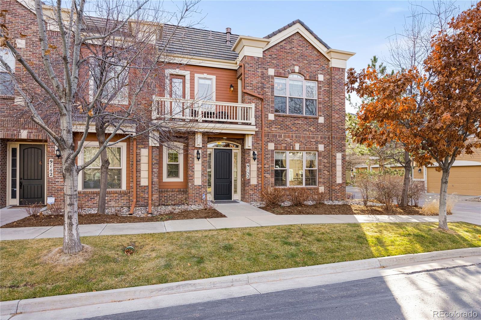 9132 Mornington Way Lone Tree, CO 80124 - Photo 2 of 44 a front view of a house with swimming pool
