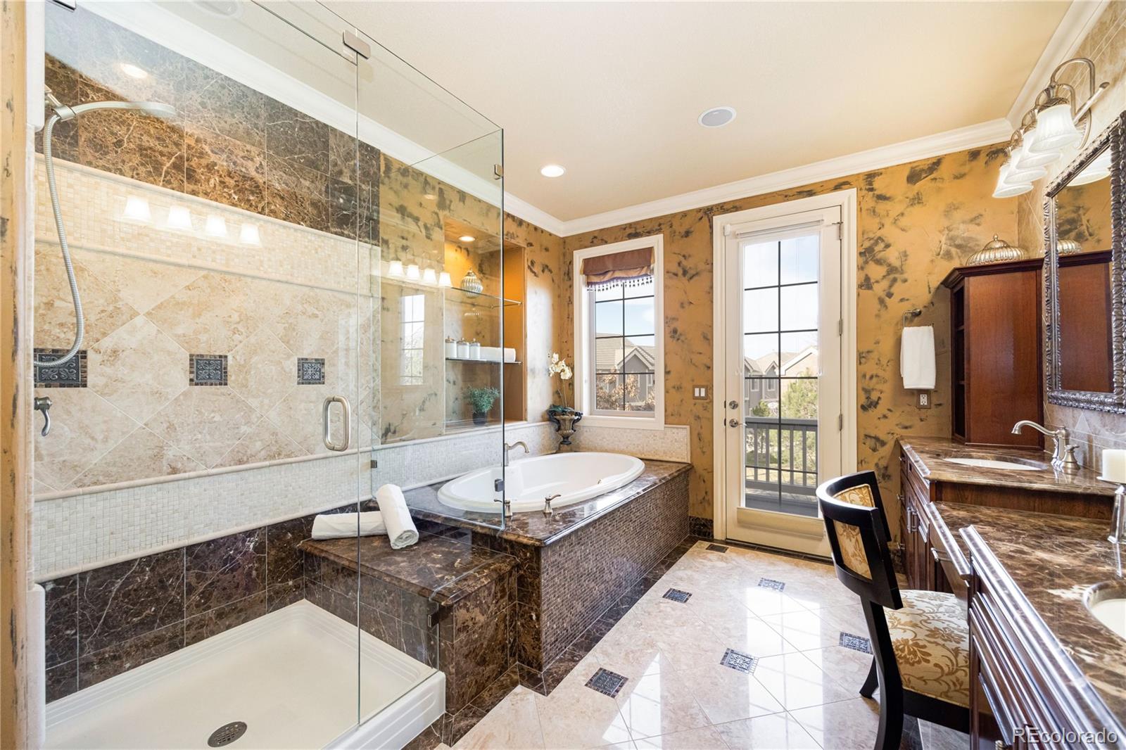 9132 Mornington Way Lone Tree, CO 80124 - Photo 24 of 44 a spacious bathroom with a tub sink and mirror