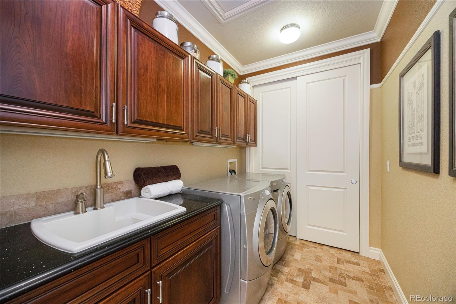 9132 Mornington Way Lone Tree, CO 80124 - Photo 27 of 44 a view of a storage and utility room with a sink