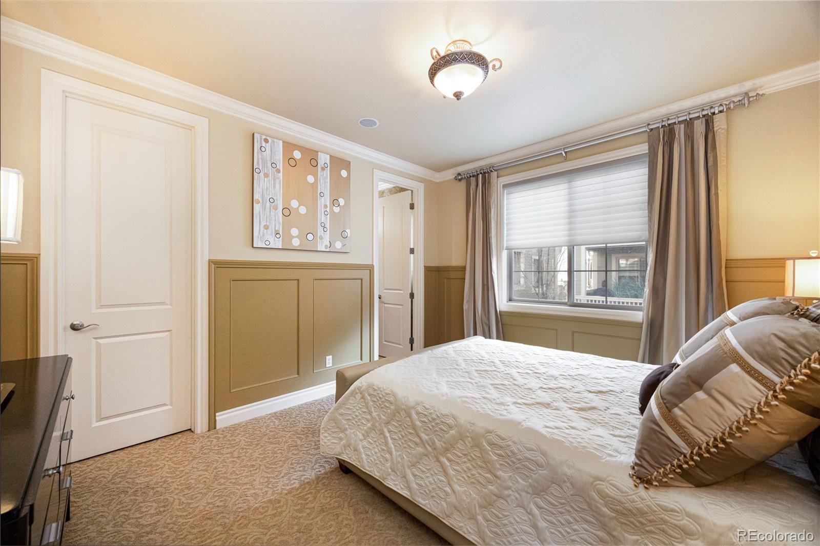 9132 Mornington Way Lone Tree, CO 80124 - Photo 28 of 44 a bedroom with a bed and a window