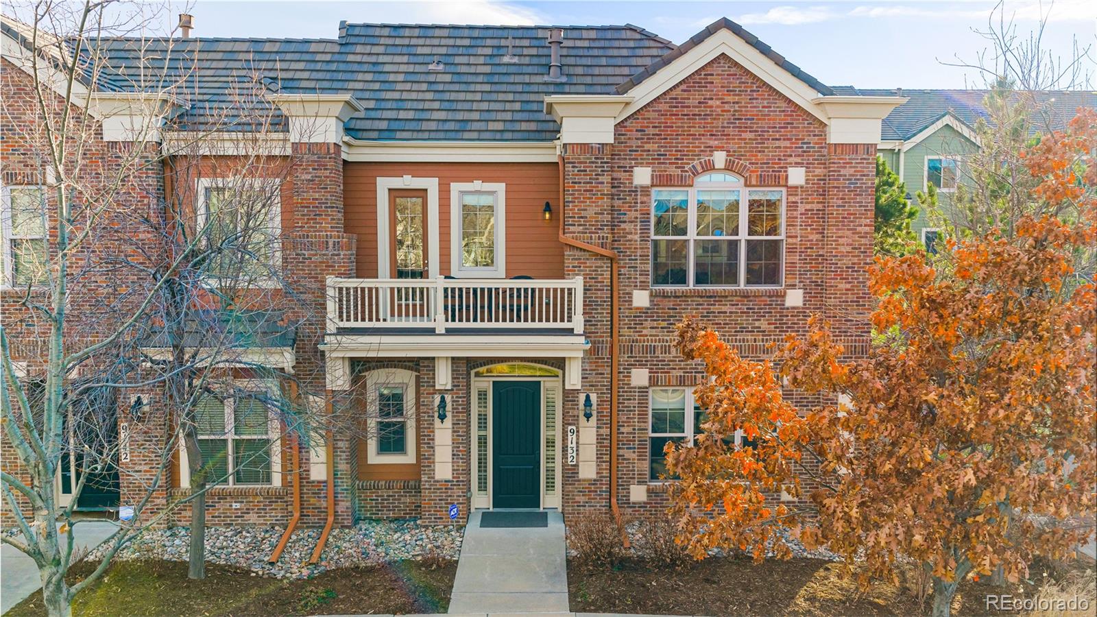 9132 Mornington Way Lone Tree, CO 80124 - Photo 37 of 44 front view of a brick house