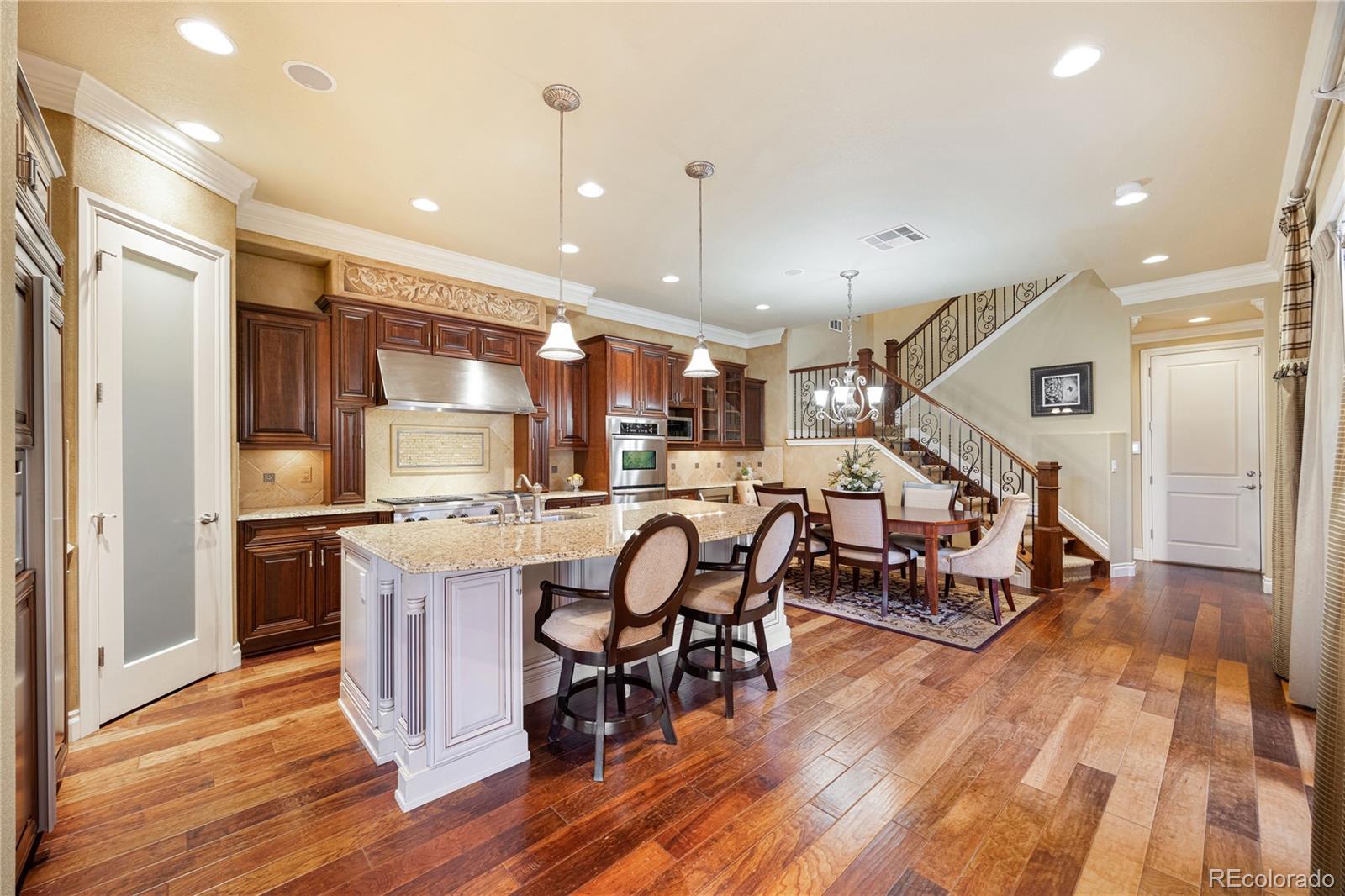 9132 Mornington Way Lone Tree, CO 80124 - Photo 7 of 44 a room with lots of chairs and mirrors