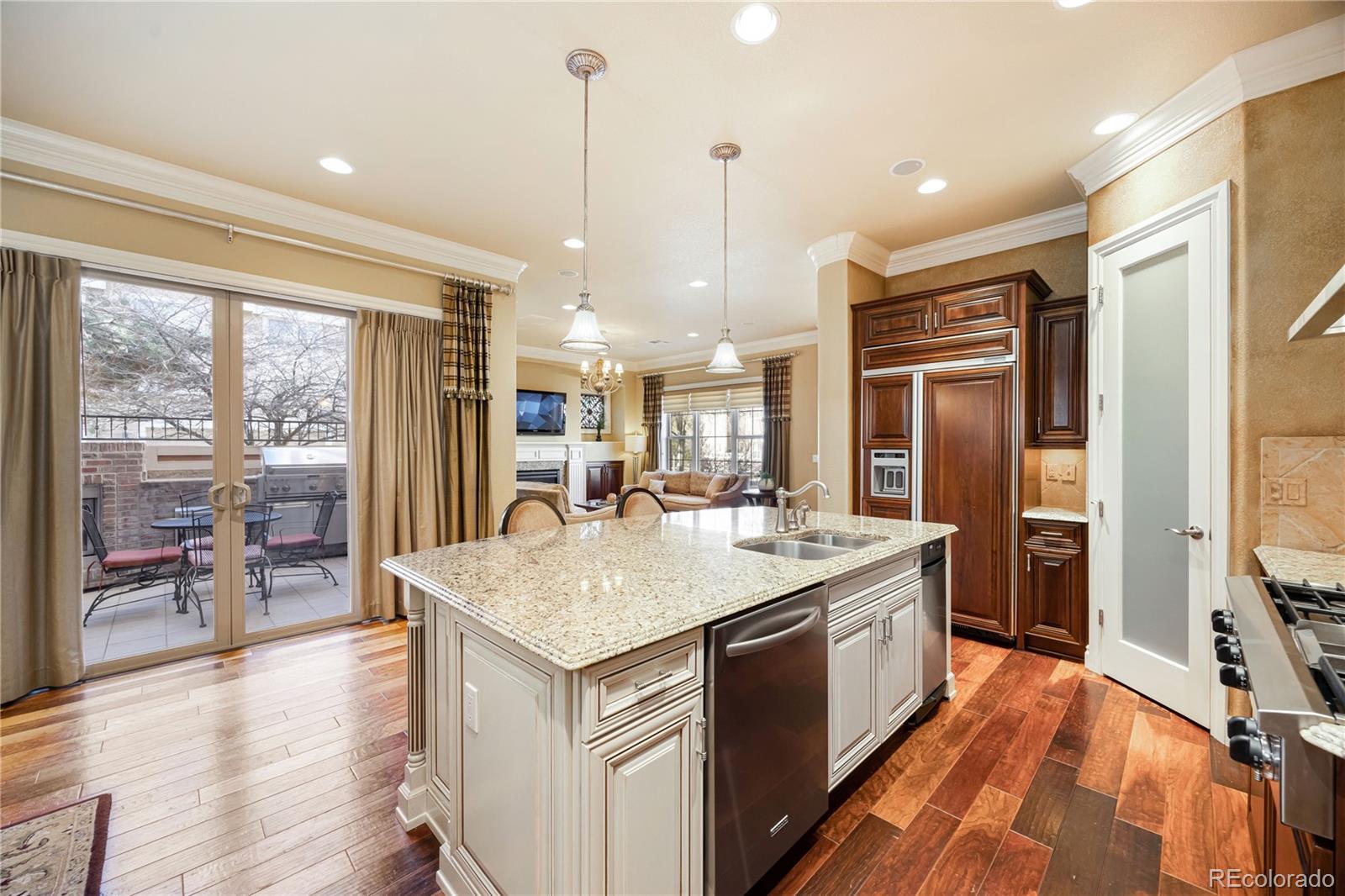 9132 Mornington Way Lone Tree, CO 80124 - Photo 9 of 44 a large kitchen with stainless steel appliances granite countertop a stove and refrigerator