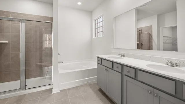 a bathroom with a bathtub and a sink