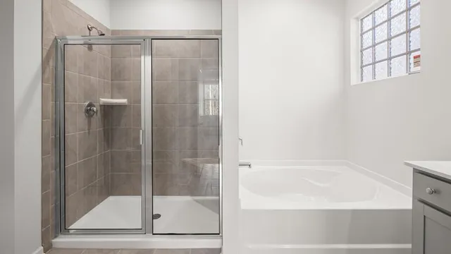 a bathroom with a glass shower door