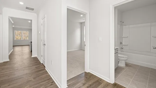 a bathroom with a toilet sink and shower