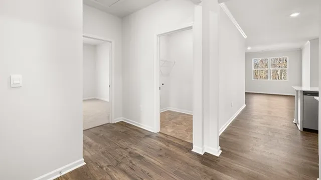 a view of hallway with wooden floor