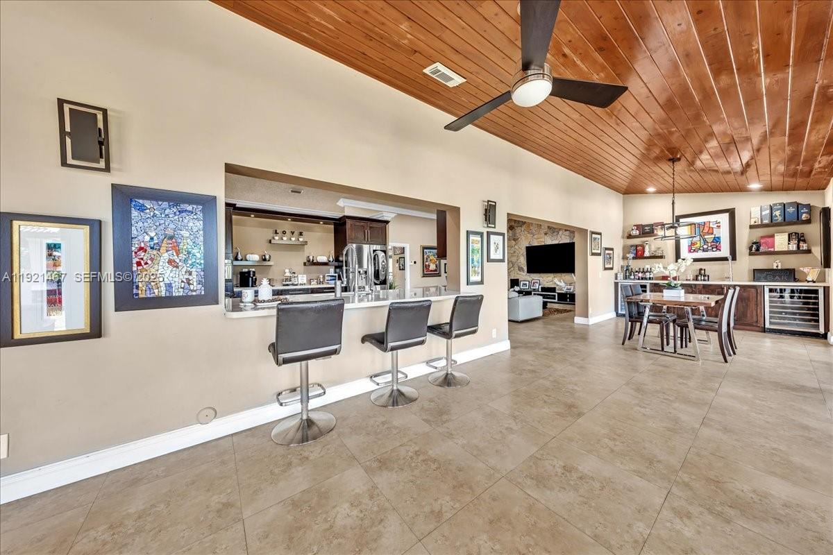 3801 Southwest 141st Avenue Miramar, FL 33027 - Photo 22 of 99 a view of a livingroom with furniture and a flat screen tv