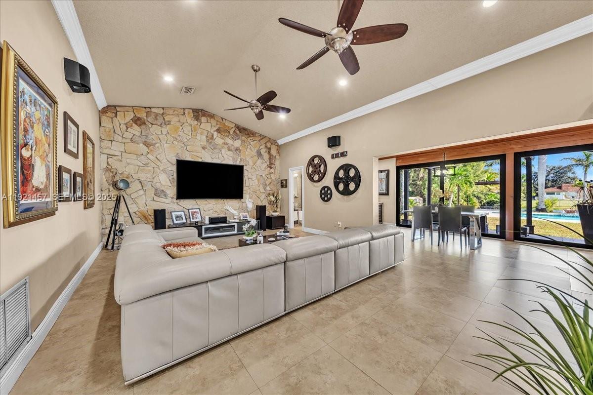 3801 Southwest 141st Avenue Miramar, FL 33027 - Photo 32 of 99 a living room with furniture and a flat screen tv