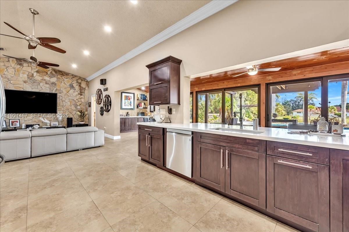 3801 Southwest 141st Avenue Miramar, FL 33027 - Photo 40 of 99 a large white kitchen with stainless steel appliances granite countertop a stove and a sink