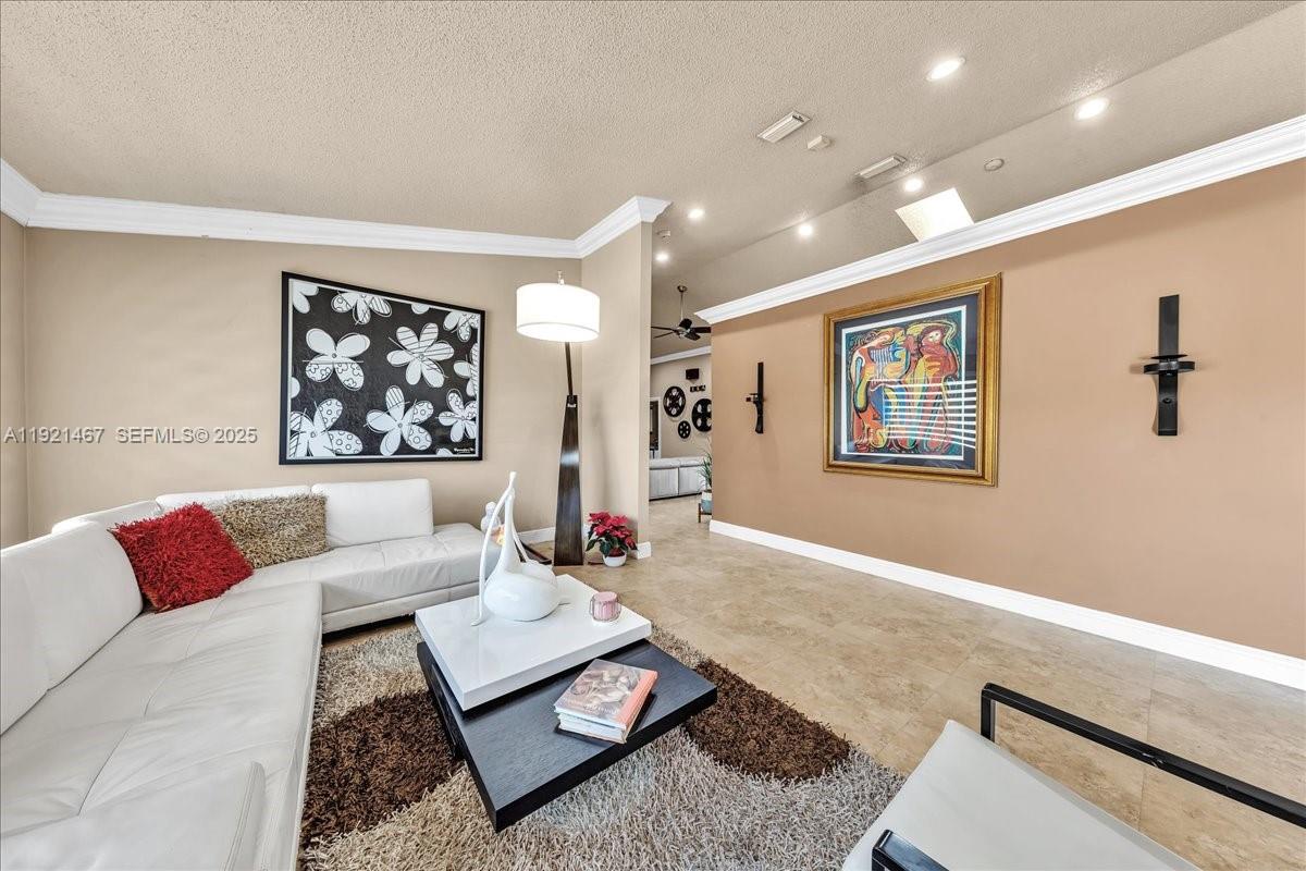 3801 Southwest 141st Avenue Miramar, FL 33027 - Photo 43 of 99 a living room with furniture and a rug