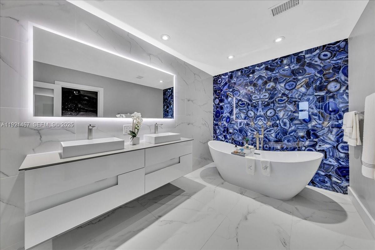 3801 Southwest 141st Avenue Miramar, FL 33027 - Photo 6 of 99 a living room with a couch and a potted plant