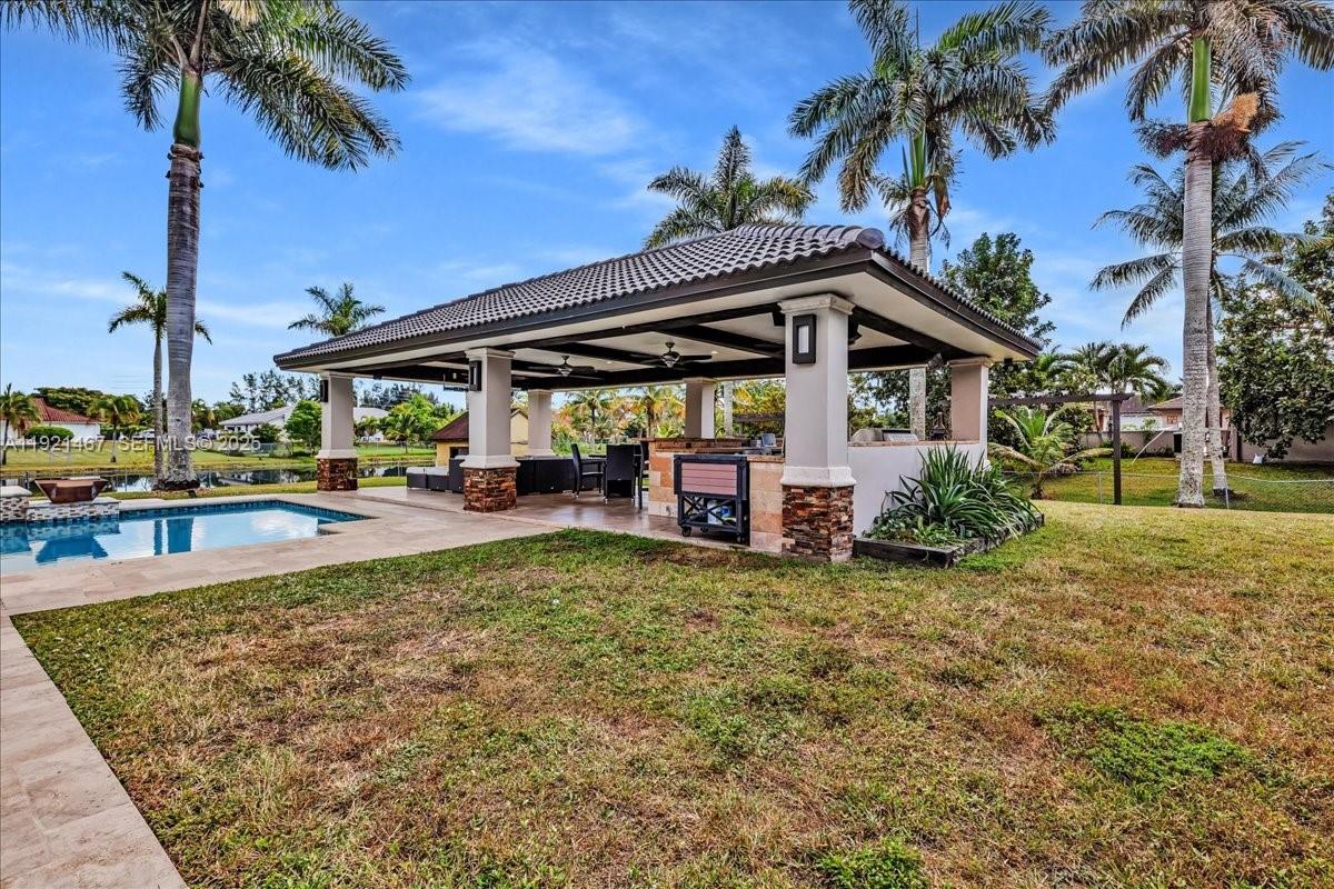 3801 Southwest 141st Avenue Miramar, FL 33027 - Photo 77 of 99 a view of a house with backyard and sitting area