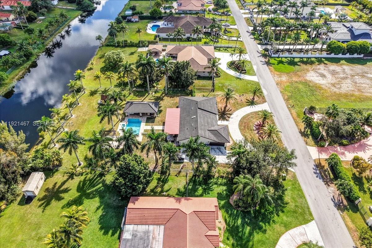 3801 Southwest 141st Avenue Miramar, FL 33027 - Photo 84 of 99 an aerial view of a house with a garden and lake view