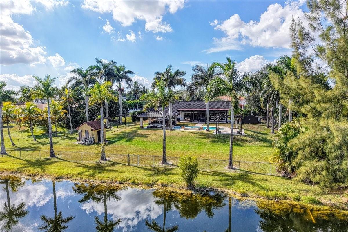 3801 Southwest 141st Avenue Miramar, FL 33027 - Photo 91 of 99 a view of a swimming pool with an outdoor seating