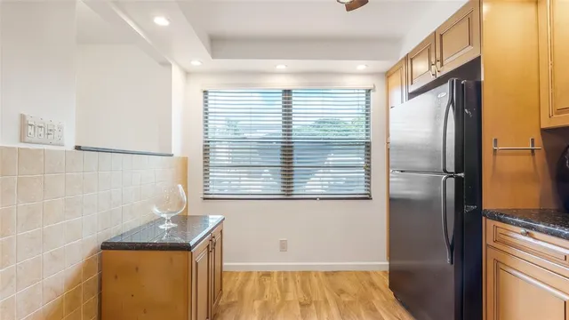 a bathroom with a bathtub and a window