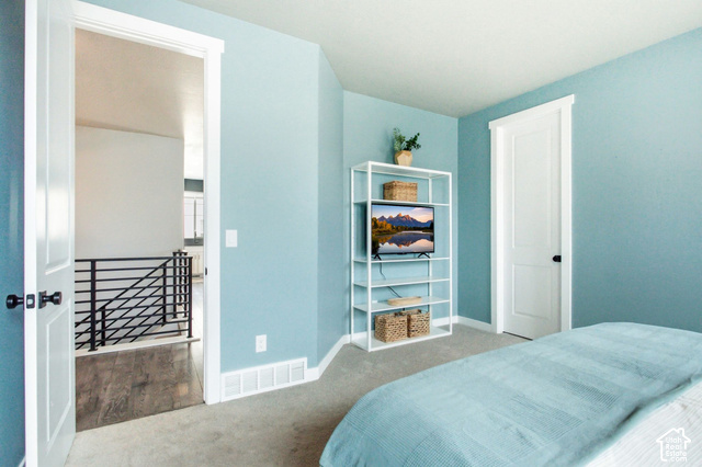 986 South Old Farm Road Heber City, UT 84032 - Photo 21 of 51 Carpeted flooring, light blue wall paint, white trim, and a white door with black hardware