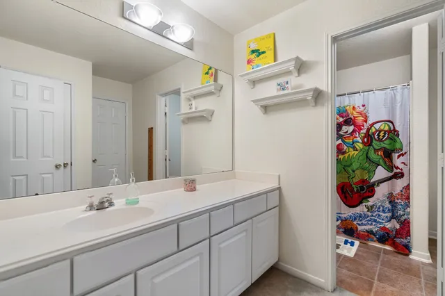 a view of a house with backyard and porch