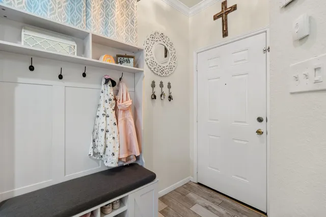 a view of an entryway with wooden floor