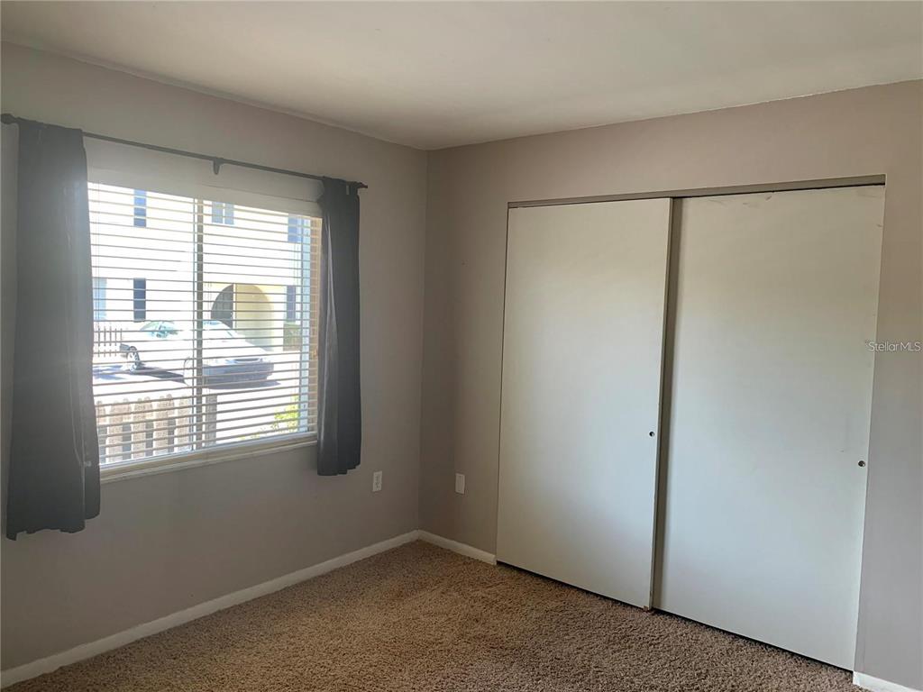 525 South Conway Road, Unit 189D Orlando, FL 32807 - Photo 11 of 19 a view of an empty room with a window