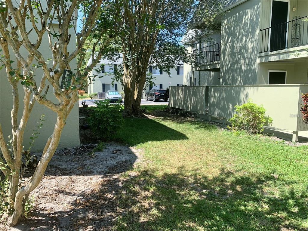 525 South Conway Road, Unit 189D Orlando, FL 32807 - Photo 16 of 19 a pathway of a house with a yard