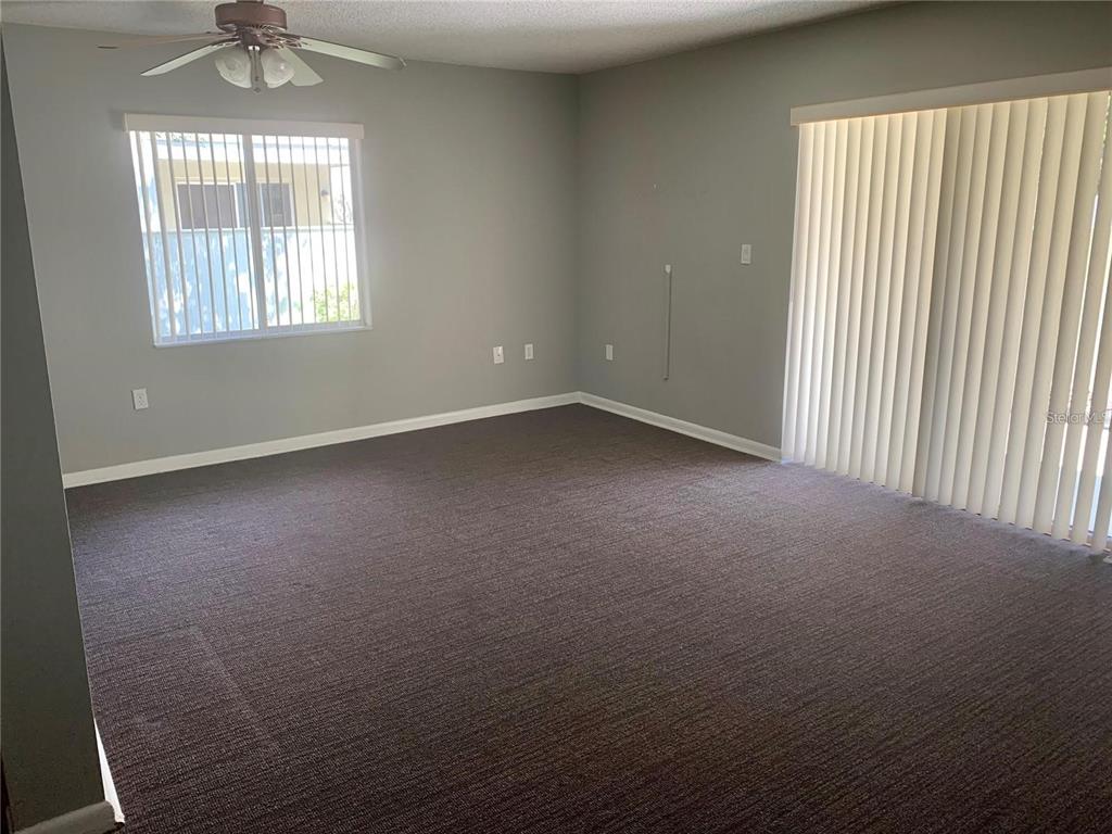 525 South Conway Road, Unit 189D Orlando, FL 32807 - Photo 3 of 19 an empty room with a window