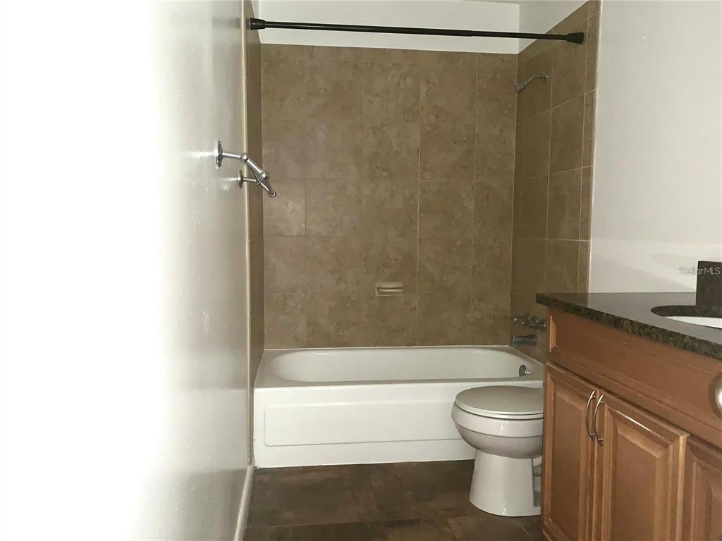 525 South Conway Road, Unit 189D Orlando, FL 32807 - Photo 8 of 19 a bathroom with a shower and a toilet