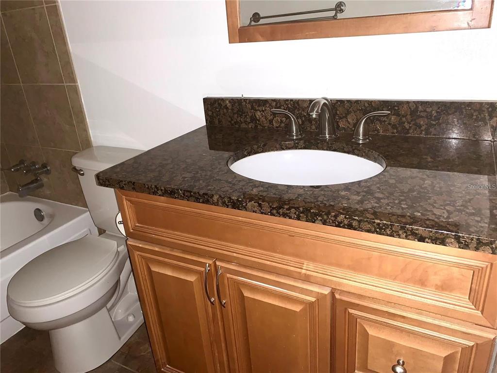 525 South Conway Road, Unit 189D Orlando, FL 32807 - Photo 9 of 19 a bathroom with a toilet and a sink