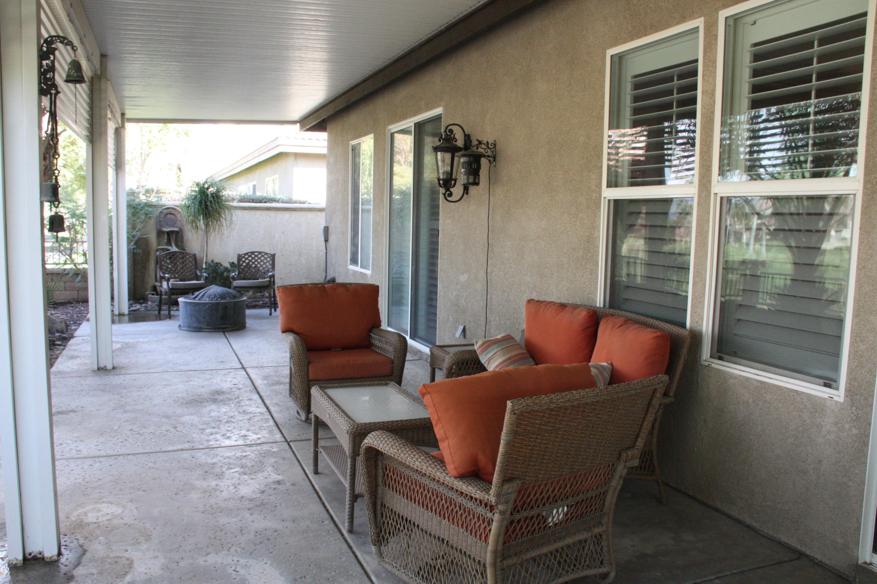 49475 Redford Way Indio, CA 92201 - Photo 11 of 58 a living room with furniture and a large window
