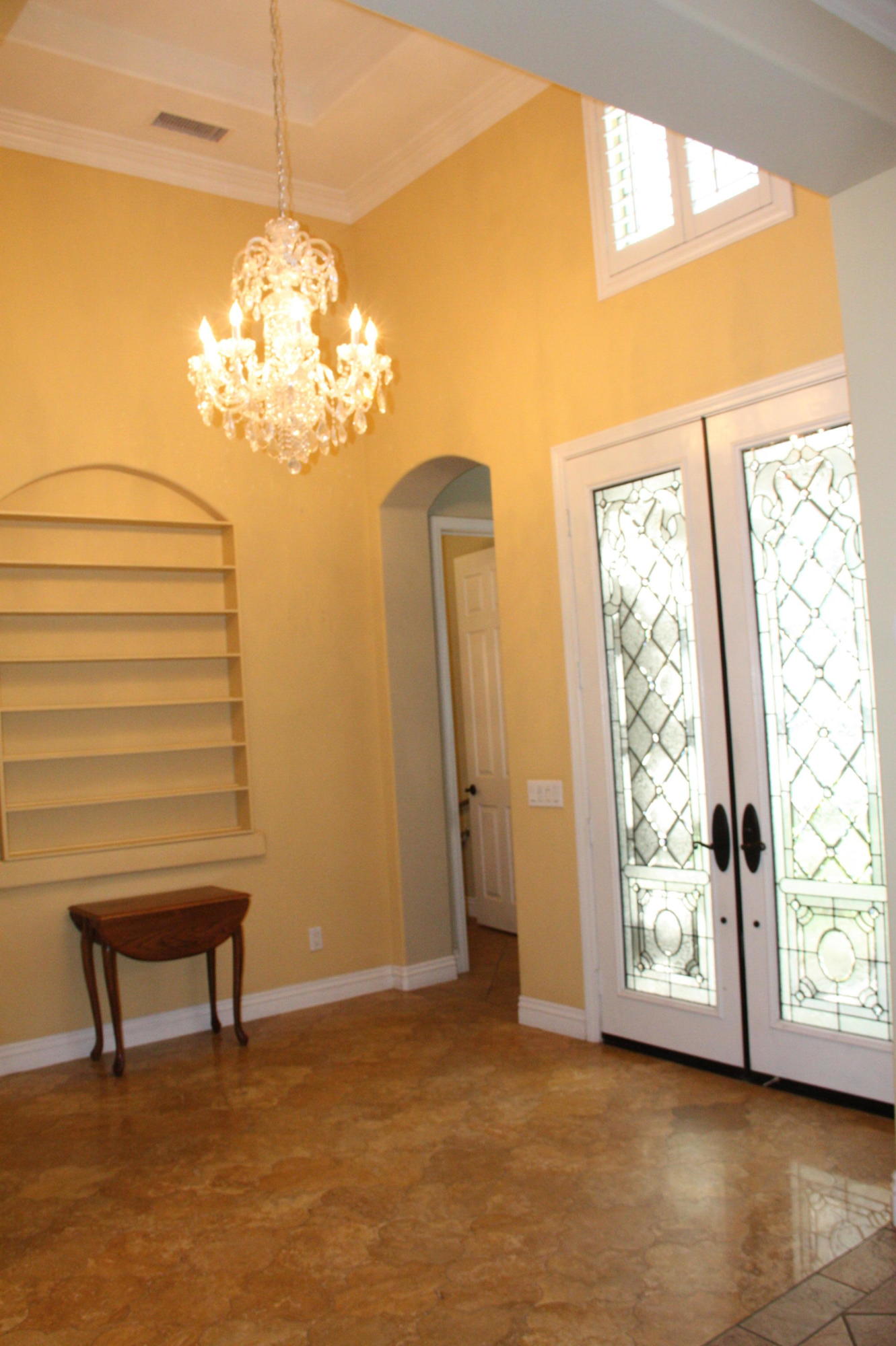 49475 Redford Way Indio, CA 92201 - Photo 15 of 58 a view of a room with a window and a chandelier