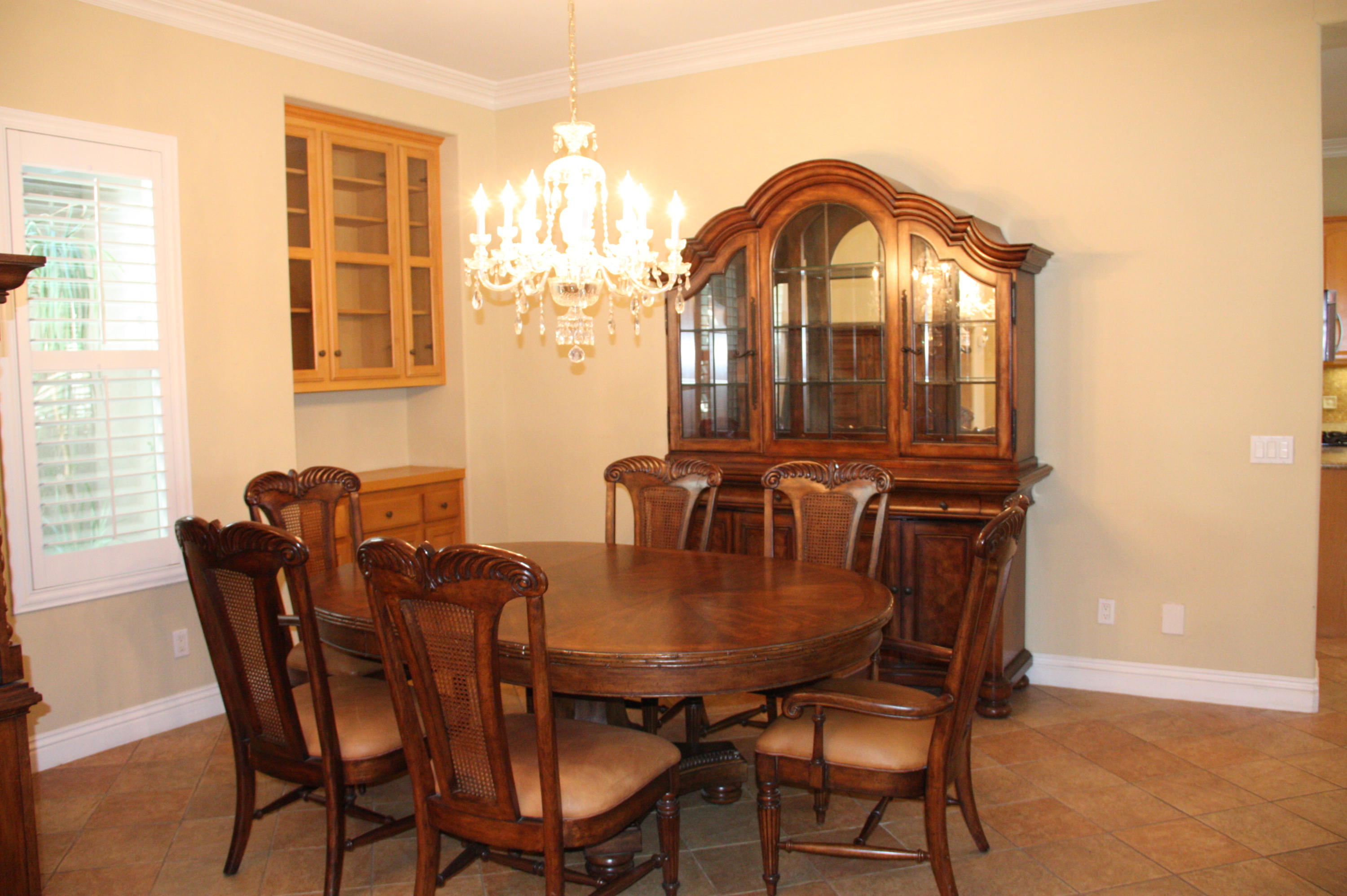 49475 Redford Way Indio, CA 92201 - Photo 16 of 58 a view of a dining room with furniture and window