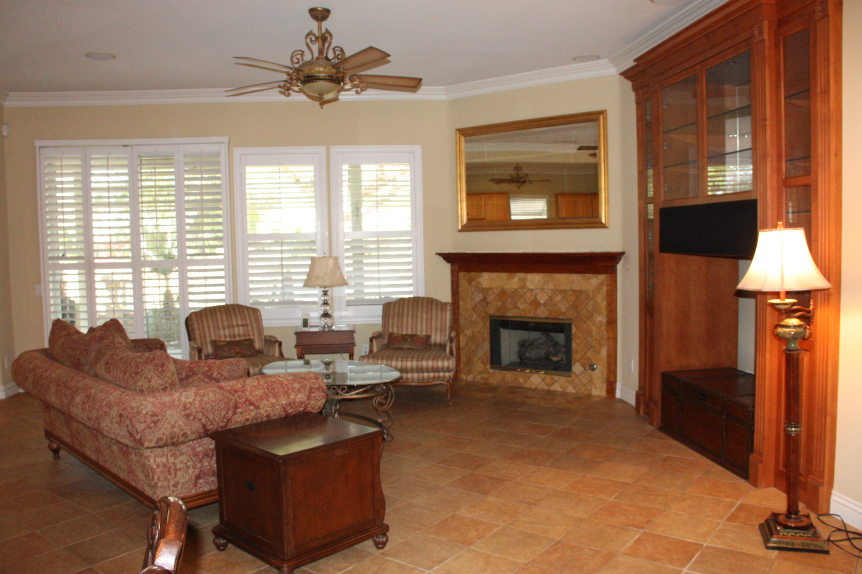 49475 Redford Way Indio, CA 92201 - Photo 17 of 58 a living room with furniture a window and a fireplace