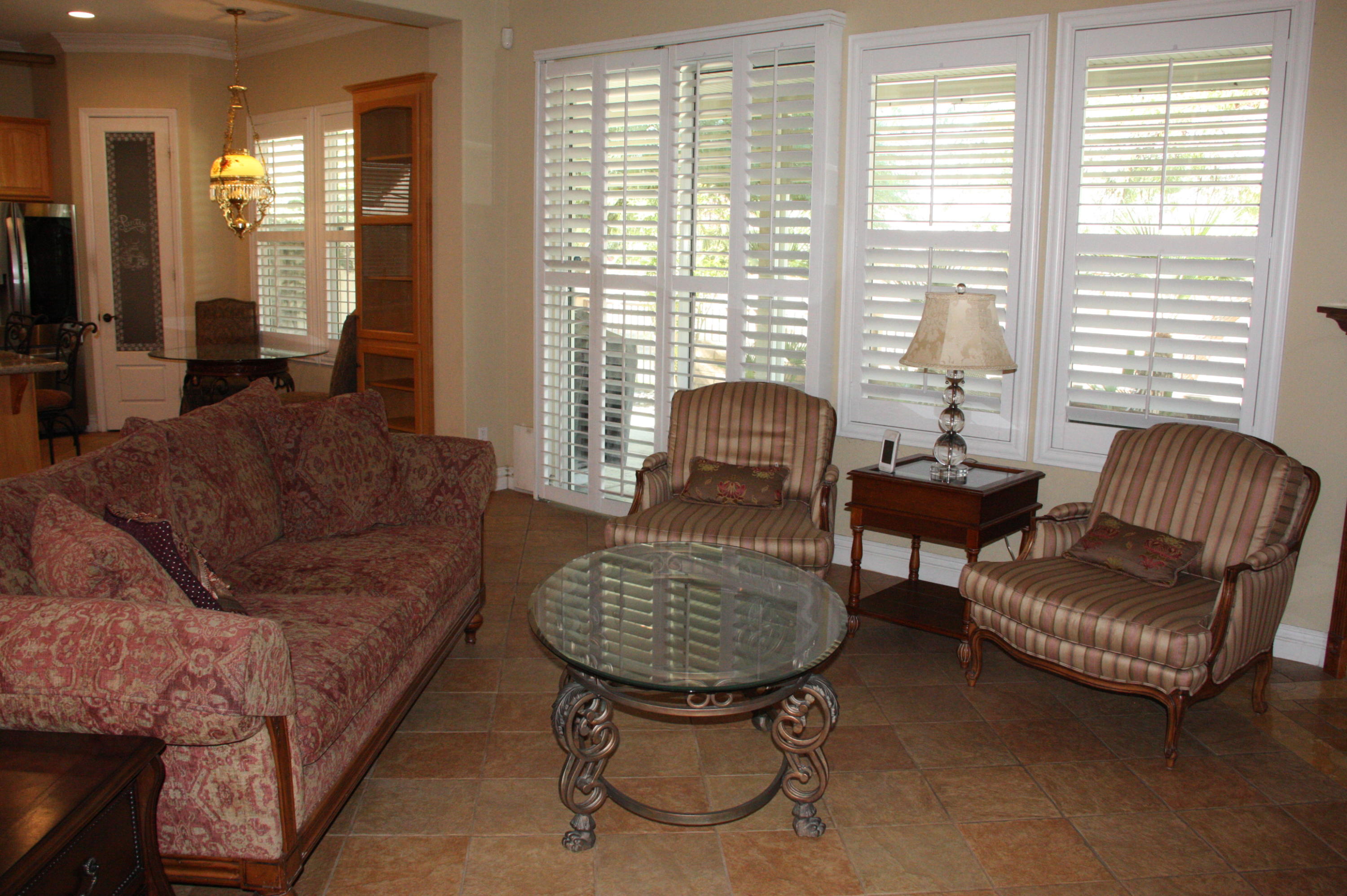 49475 Redford Way Indio, CA 92201 - Photo 18 of 58 a living room with furniture and a potted plant