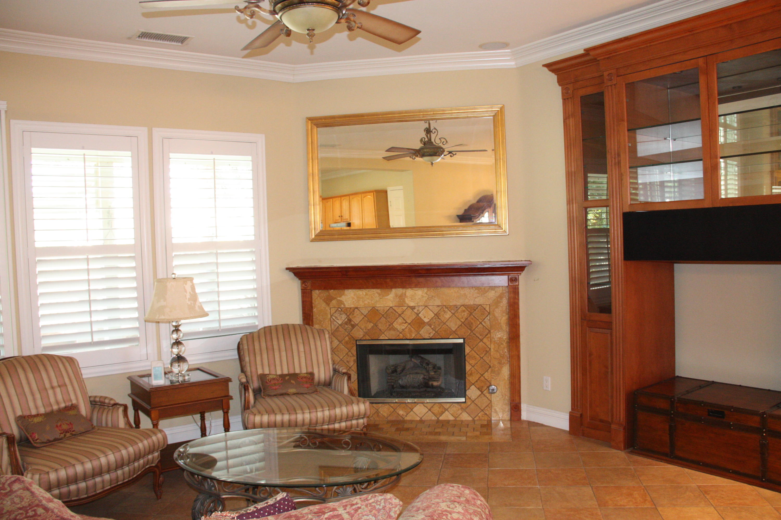49475 Redford Way Indio, CA 92201 - Photo 19 of 58 a living room with furniture and a fireplace
