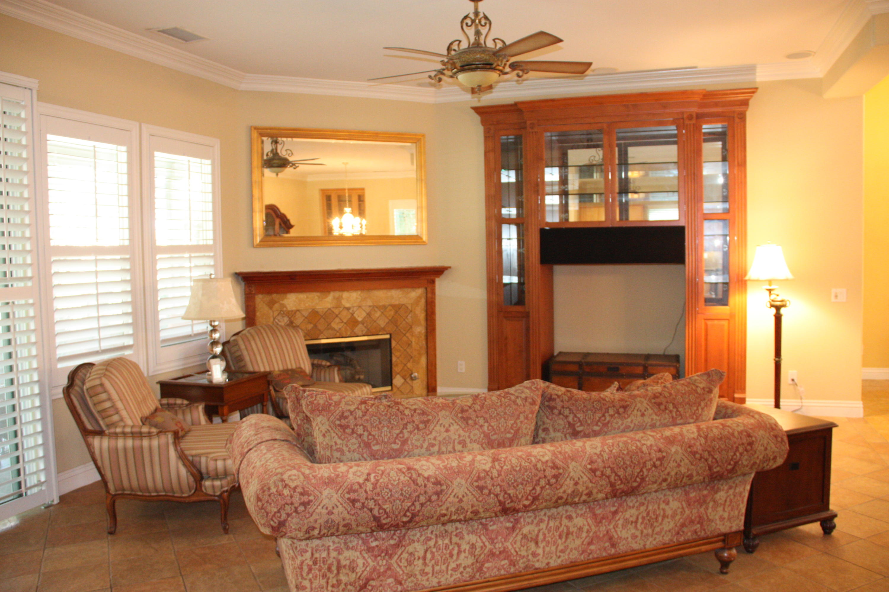 49475 Redford Way Indio, CA 92201 - Photo 20 of 58 a bedroom with a large bed and a fireplace