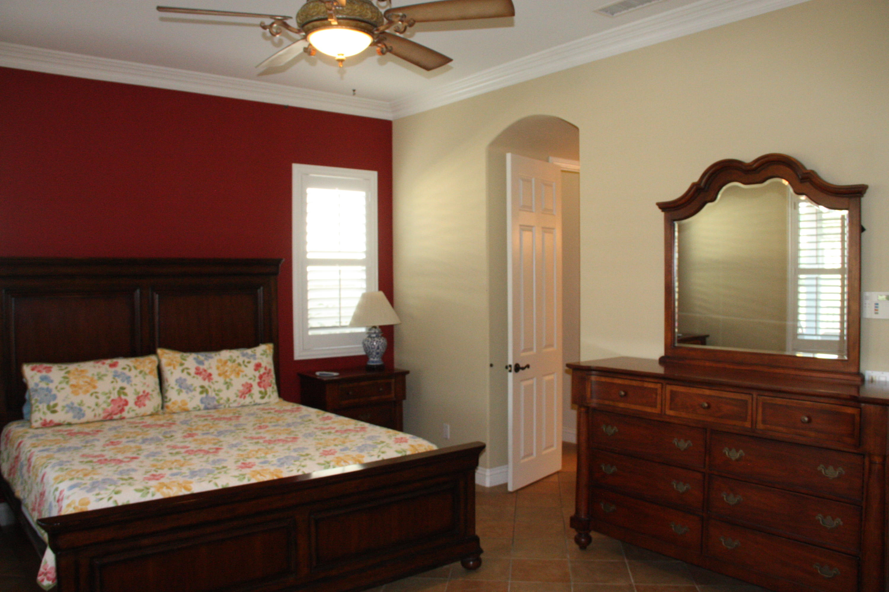 49475 Redford Way Indio, CA 92201 - Photo 33 of 58 a bedroom with a bed and a dresser