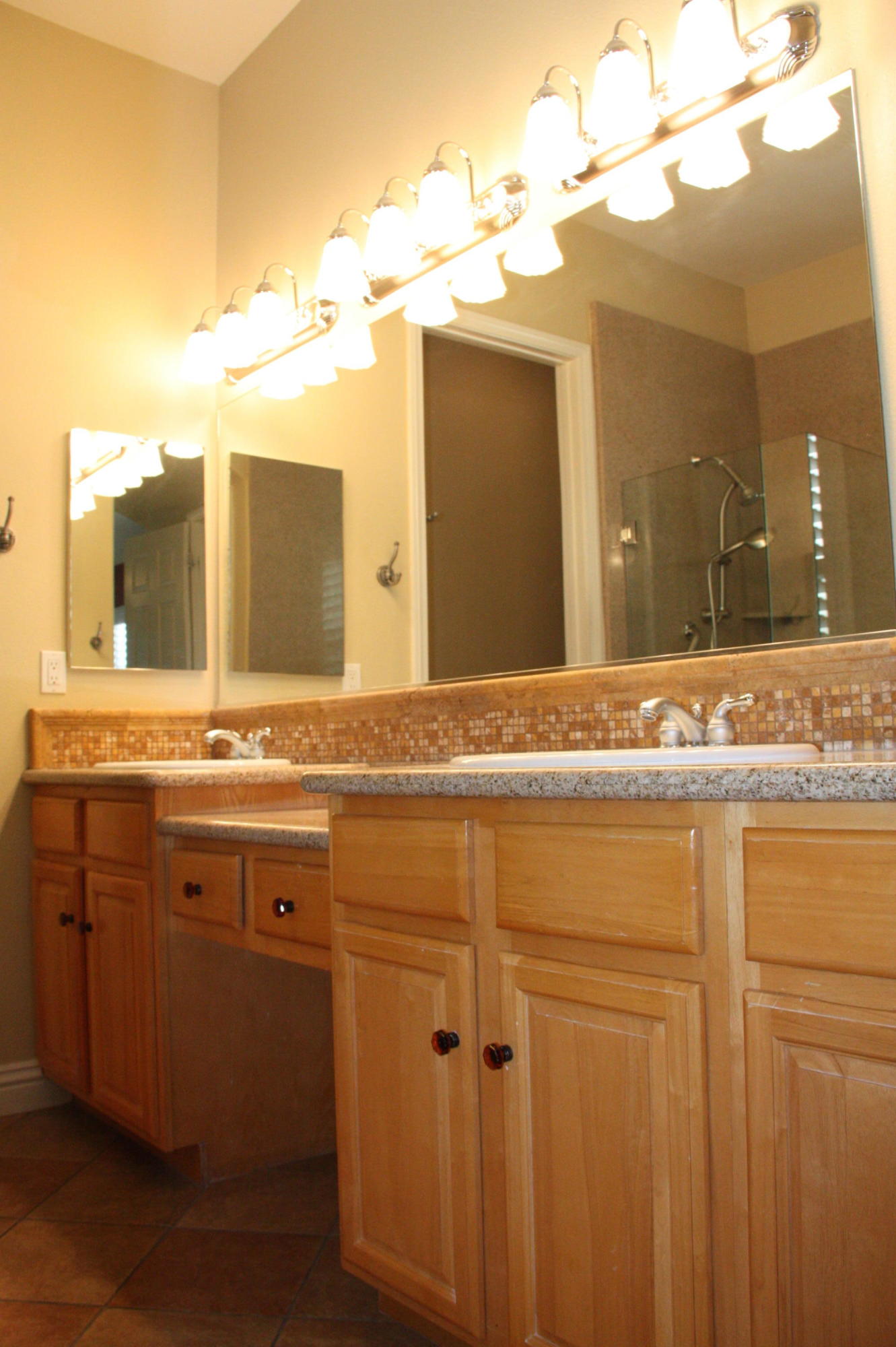 49475 Redford Way Indio, CA 92201 - Photo 36 of 58 a bathroom with a sink and a mirror