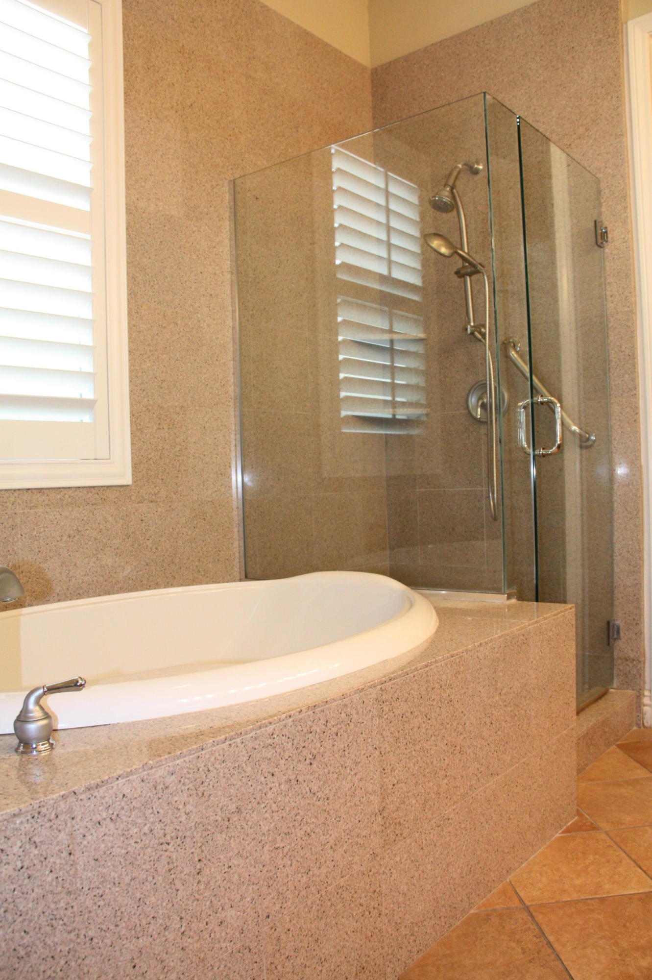 49475 Redford Way Indio, CA 92201 - Photo 37 of 58 a bathroom with a bathtub and shower