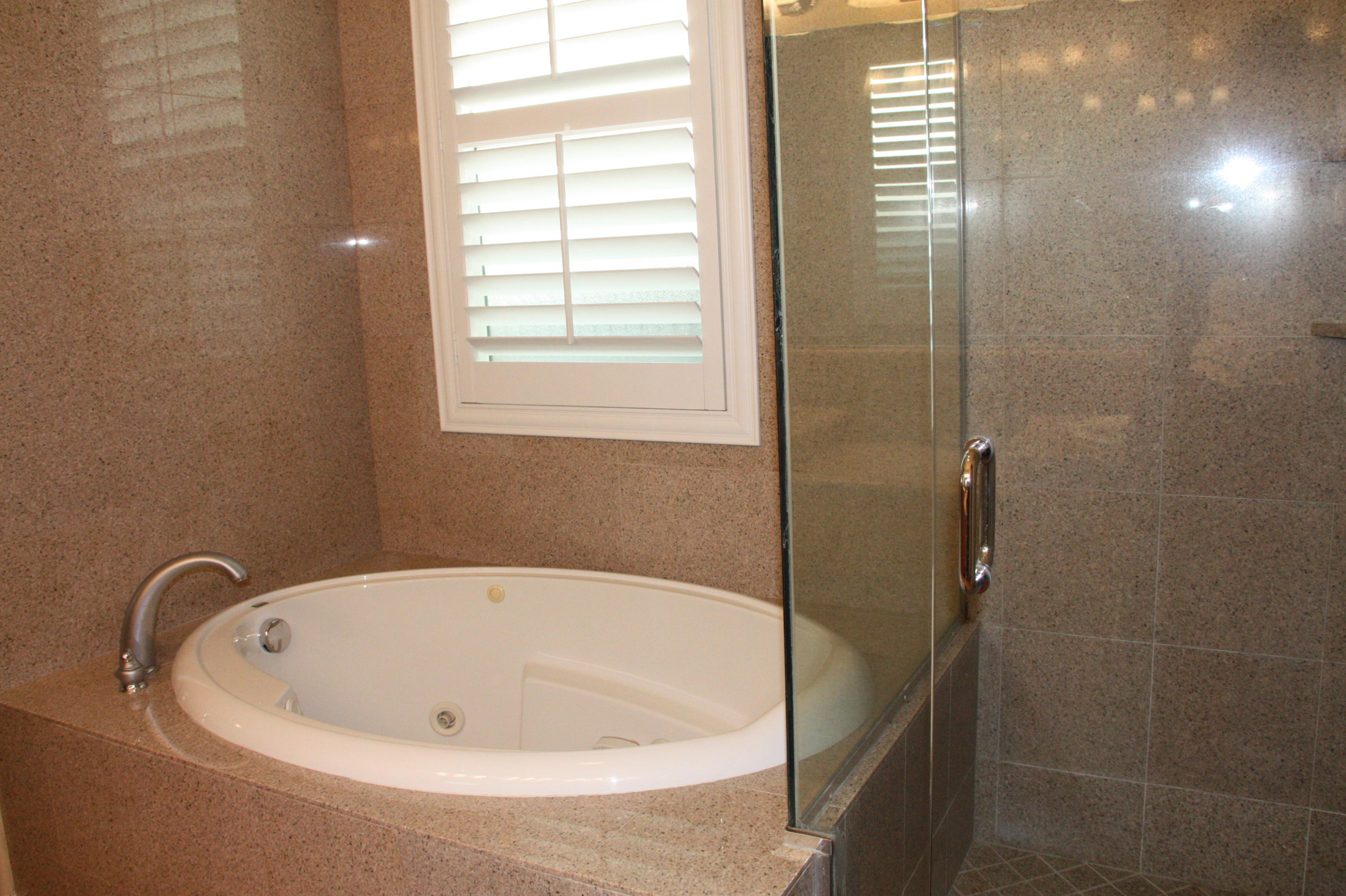 49475 Redford Way Indio, CA 92201 - Photo 39 of 58 a white bath tub sitting next to a window