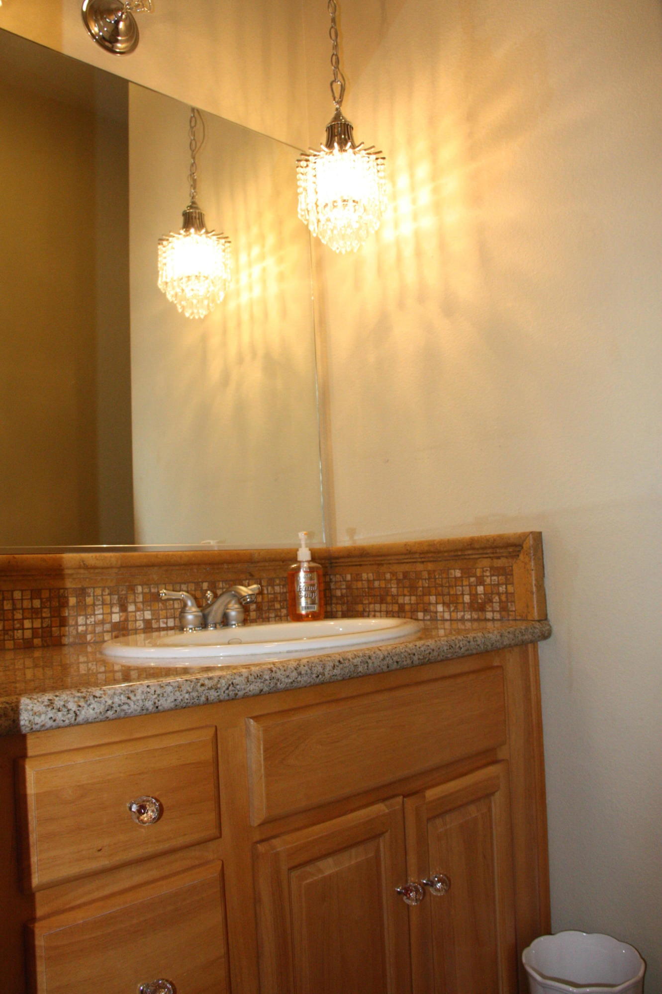 49475 Redford Way Indio, CA 92201 - Photo 44 of 58 a bathroom with a granite countertop sink a mirror and a toilet