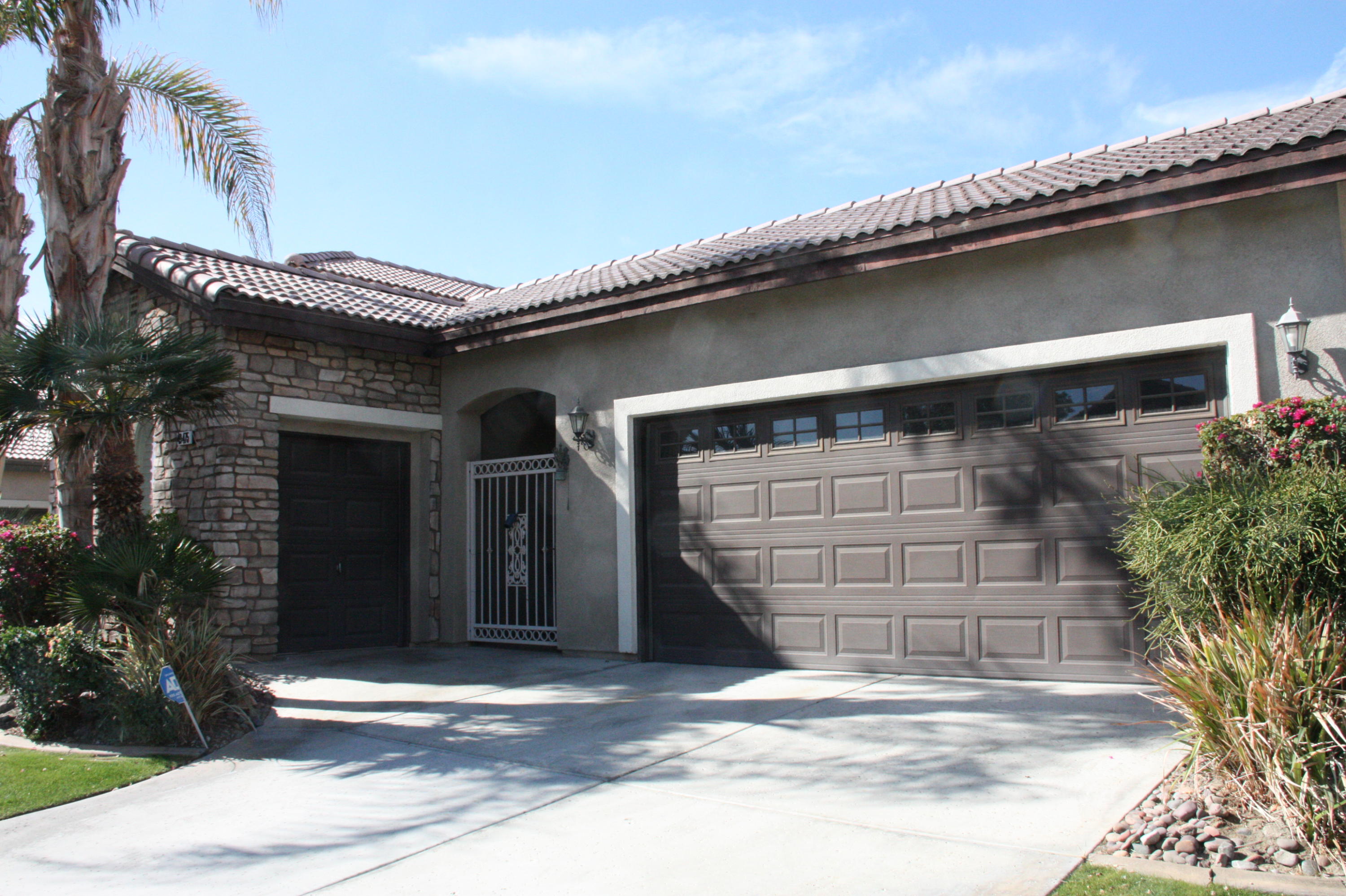 49475 Redford Way Indio, CA 92201 - Photo 8 of 58 a front view of a house