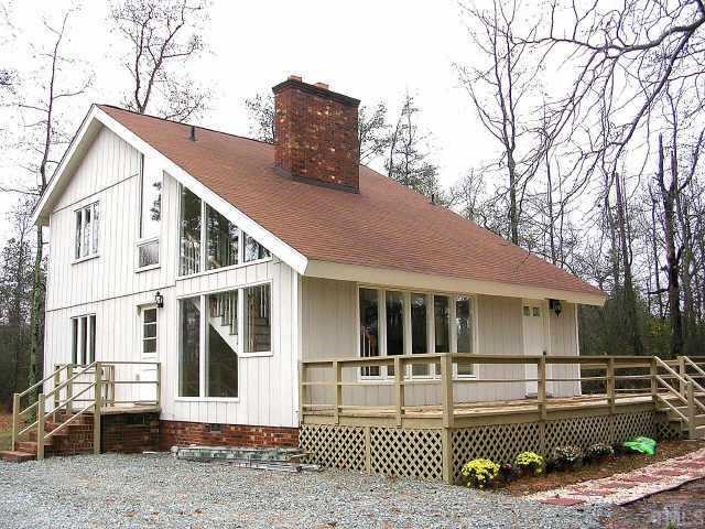 81 Moriah Road Rougemont, NC 27572 - Photo 1 of 10 a front view of a house with a yard