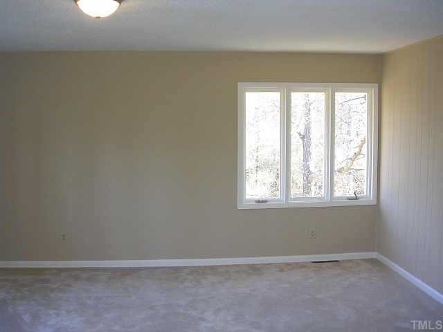 81 Moriah Road Rougemont, NC 27572 - Photo 8 of 10 an empty room with a window