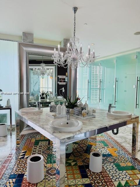 475 Brickell Avenue, Unit 4910 Miami, FL 33131 - Photo 22 of 25 a room with a table and chairs