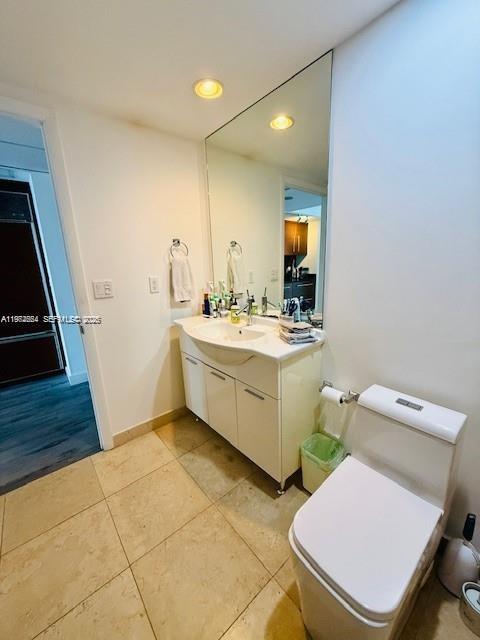 475 Brickell Avenue, Unit 4910 Miami, FL 33131 - Photo 5 of 25 a bathroom with a sink toilet and mirror