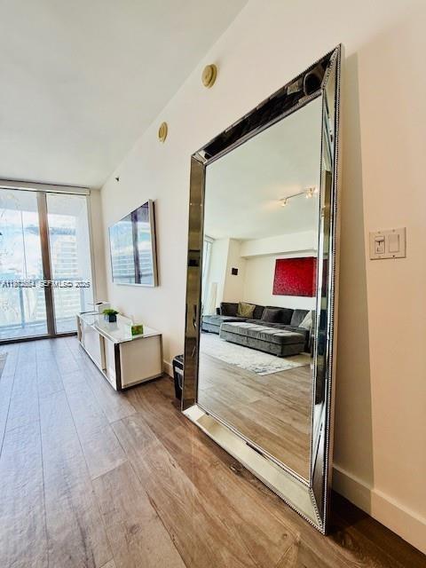 475 Brickell Avenue, Unit 4910 Miami, FL 33131 - Photo 6 of 25 a living room with furniture and a flat screen tv